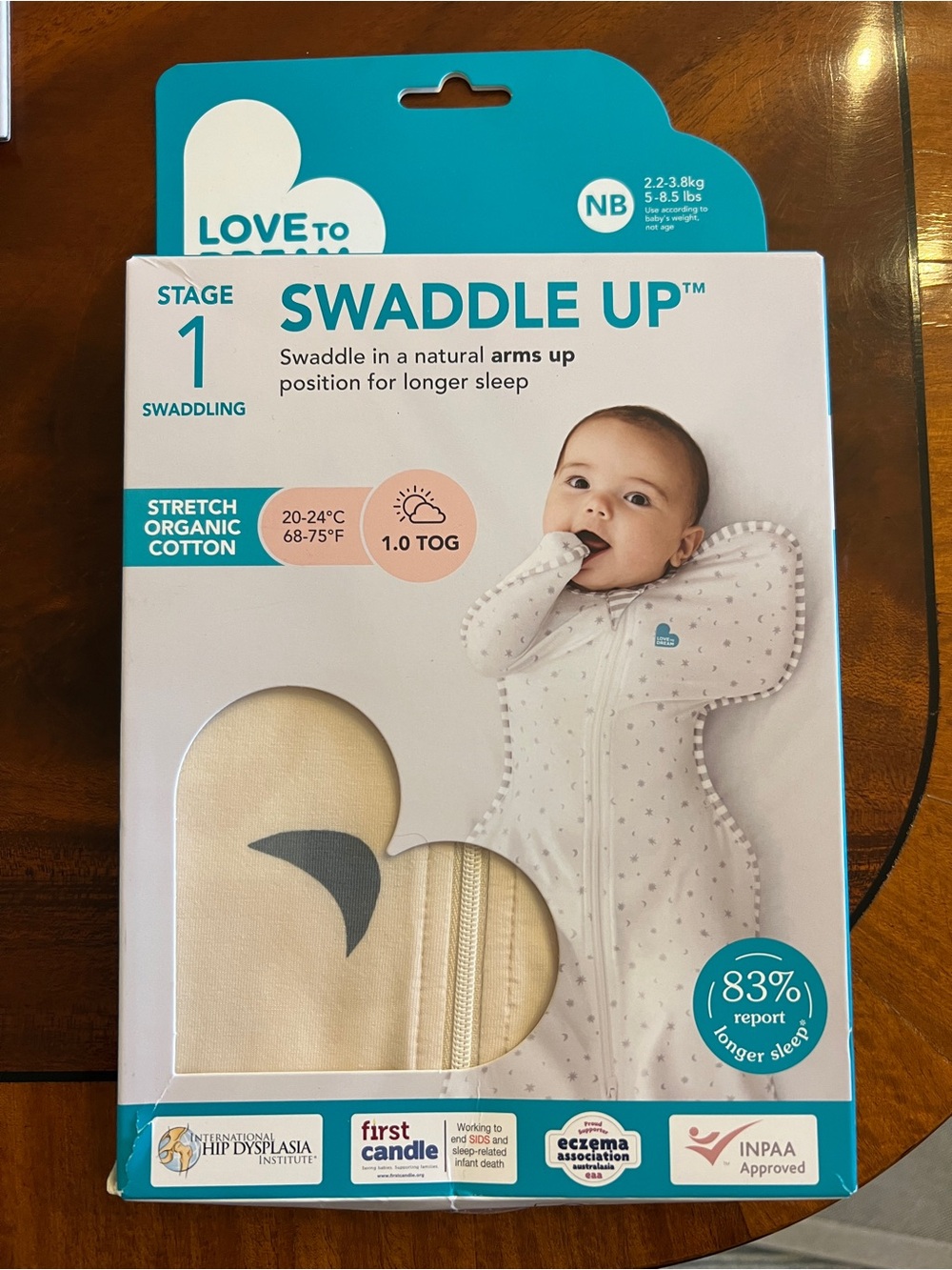 Love to dream Swaddle Up One-Piece in Cream and Teal Packaging